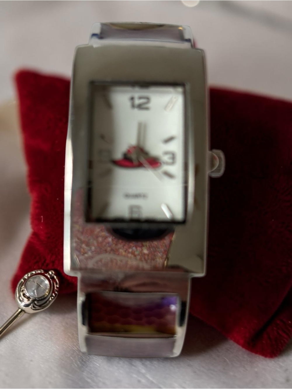 Red Hat Society Silver-Tone Bangle Cuff Watch — Rectangular Dial, Red Hat Logo